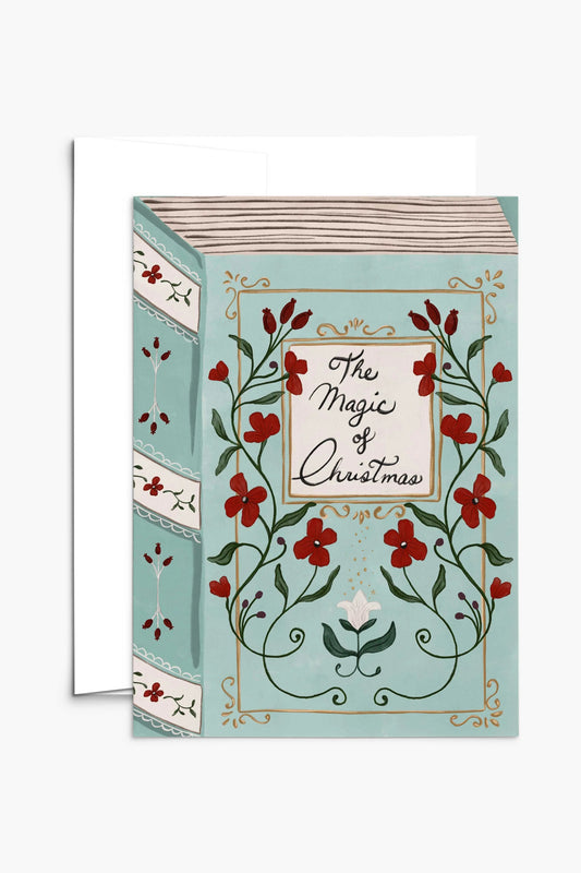 Carte La Magie de Noël affichée avec enveloppe blanche, illustration vintage bleu et rouge