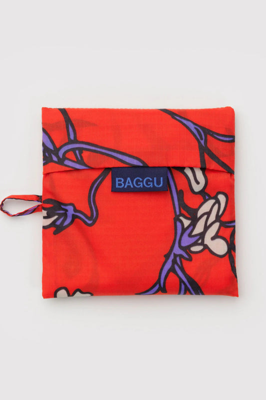 Sac réutilisable rouge Snapdragon replié dans sa pochette carré