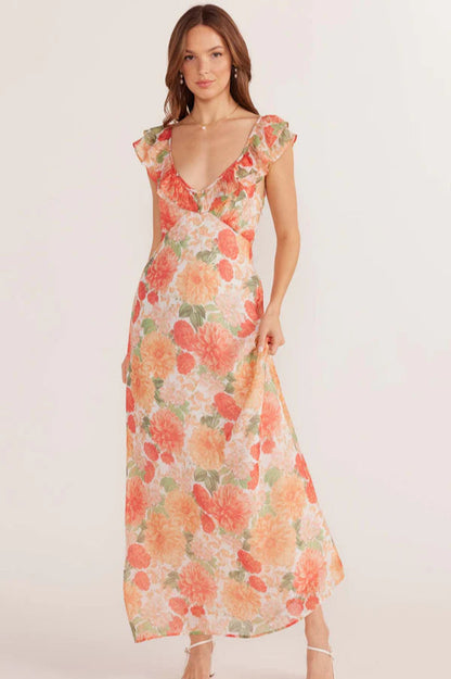 Robe longue Aida avec décolleté en V et volants sur les manches.