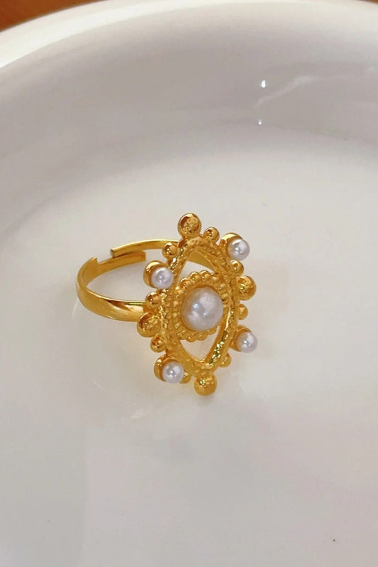 Bague Œil Perlé dorée en acier inoxydable plaqué or avec perles acryliques nacrées.
