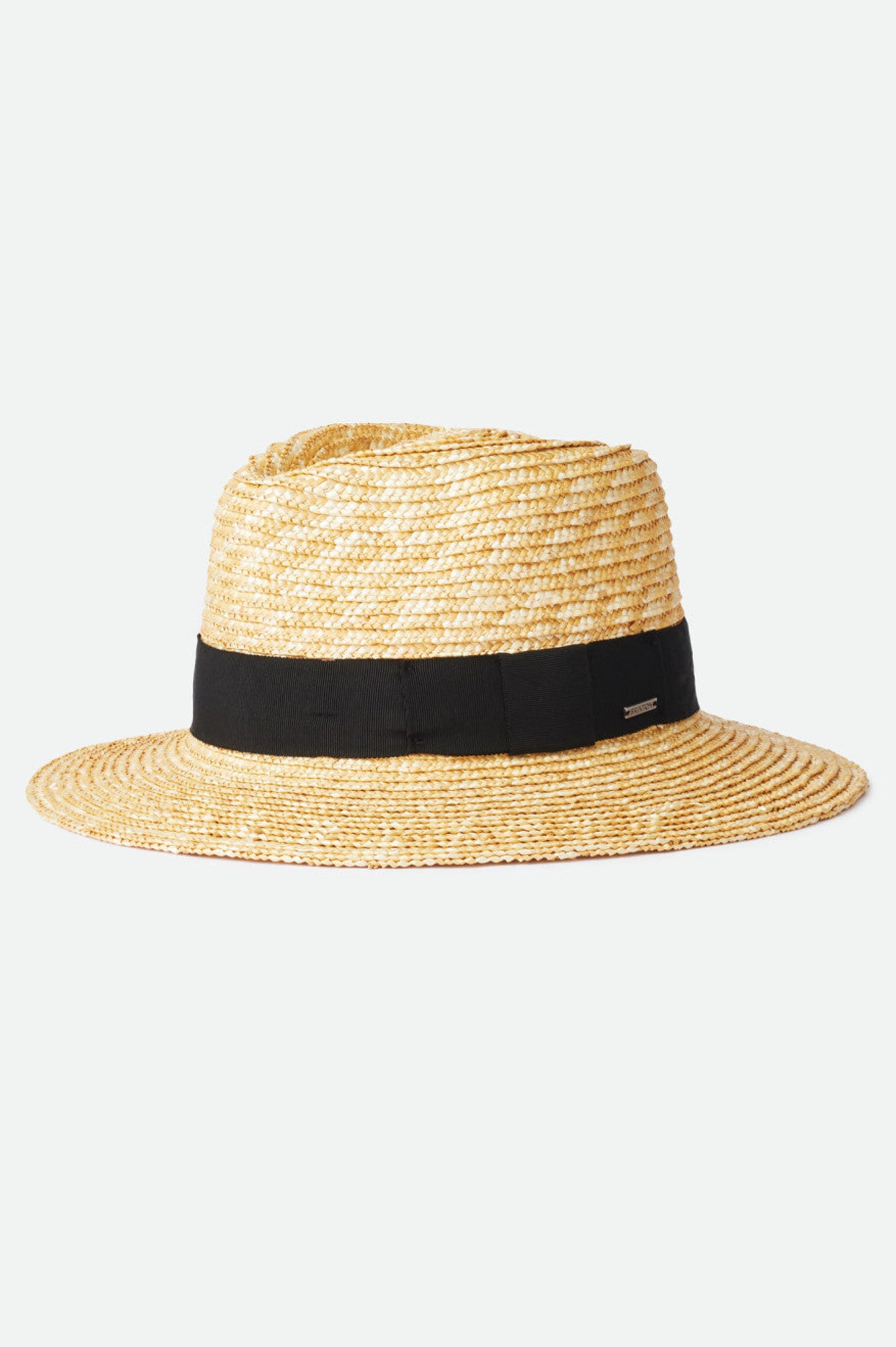 Chapeau Barbara noir en paille naturelle présenté de côté, avec bande noire en gros-grain et bord large protecteur.
