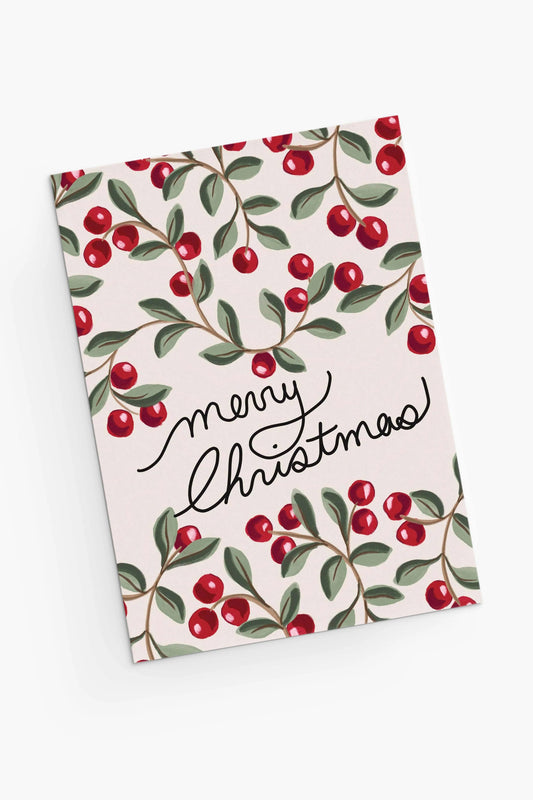 Carte de vœux Merry Christmas illustrée de baies rouges sur fond clair, vue en angle