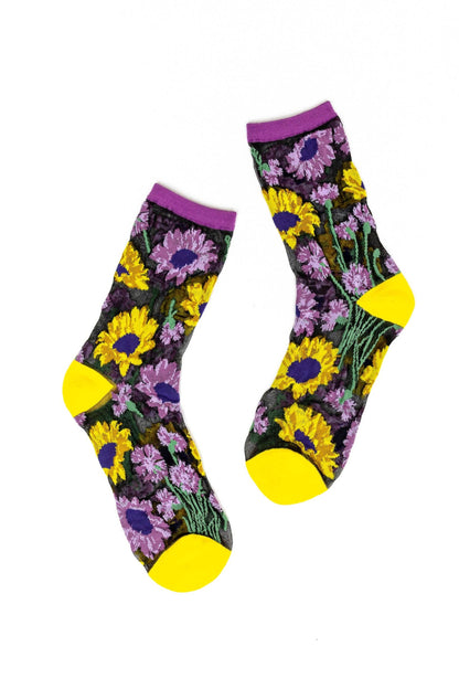 Paire de chaussettes transparentes noires à motif tournesols et fleurs violettes