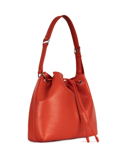 Sac Jan présenté en vue trois quarts. Forme structurée et ganse ajustable visibles.

