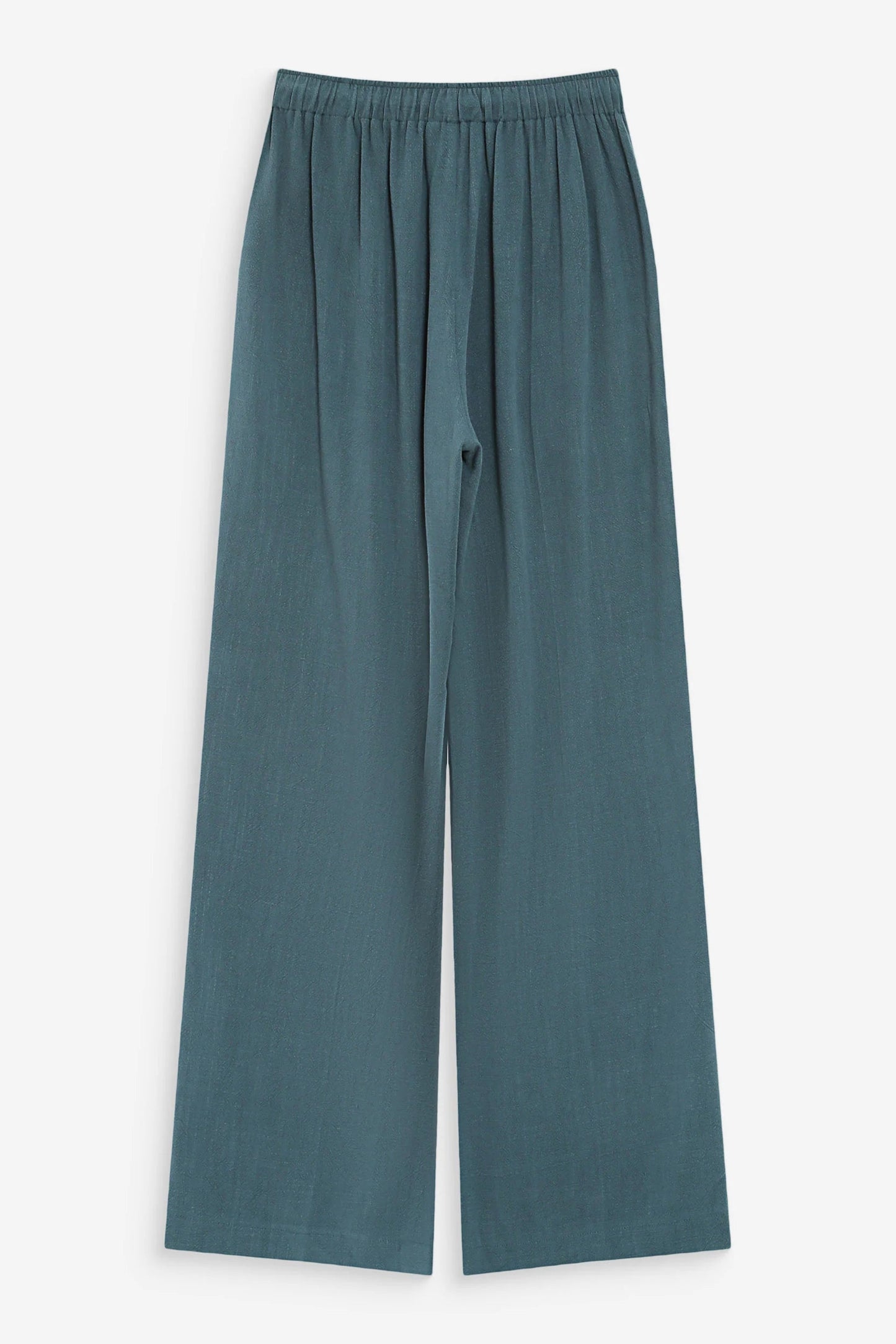  Pantalon large émeraude sur fond neutre avec coupe fluide