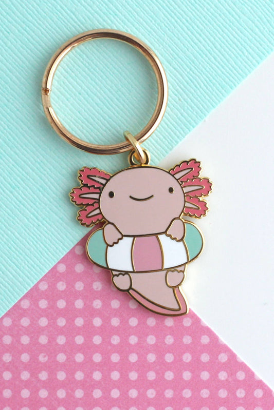 Porte-clés Axolotl Flottant en métal doré et émail pastel, accessoire mignon et coloré.