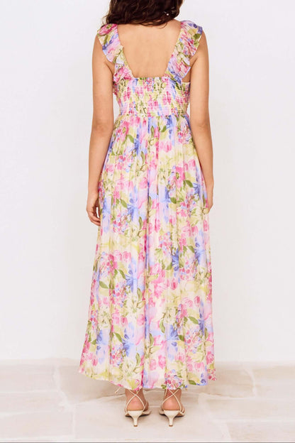 Robe longue fleurie vue de dos avec dos smocke et coupe fluide
