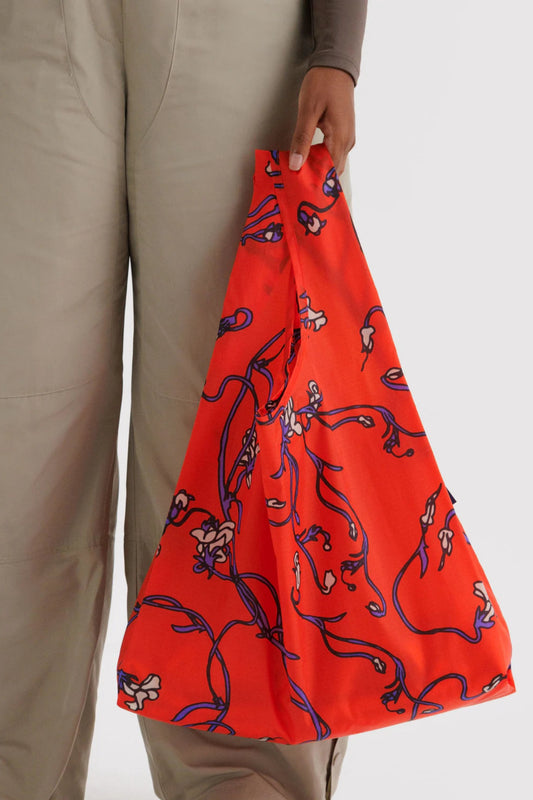 Sac réutilisable rouge Snapdragon porté à la main