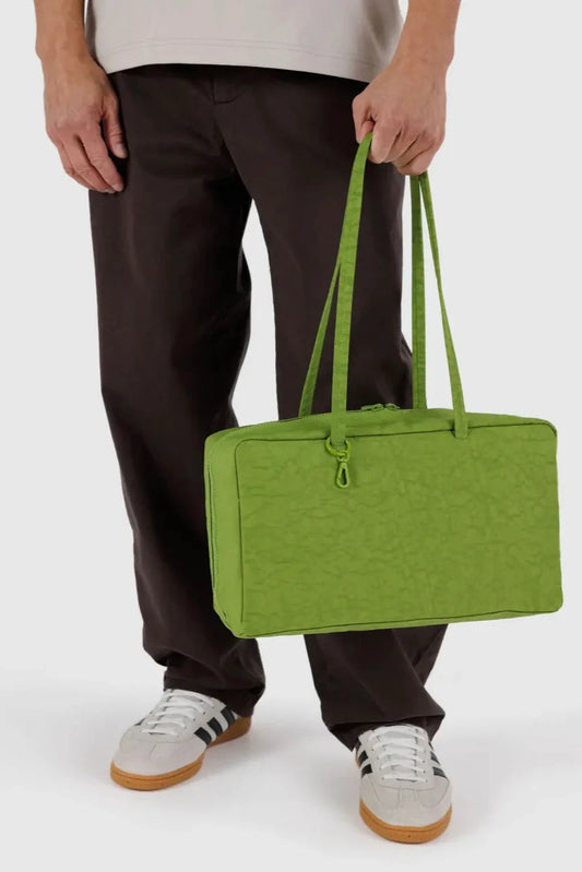 Sac Bowler jus vert porté à la main – format spacieux et moderne