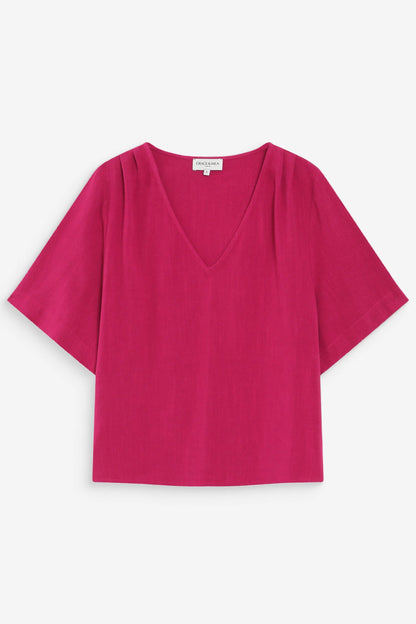 Top pivoine sur fond neutre avec col en V