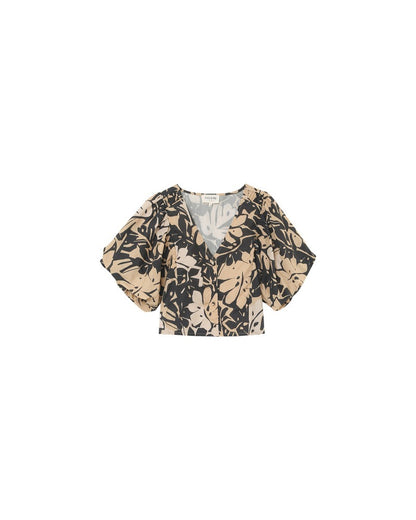 Vue avant du top court tropical noir et beige – Décolleté V et manches bouffantes