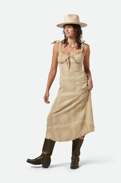 Vue de face de la robe longue beige avec imprimé bandana – bretelles nouées et coupe fluide